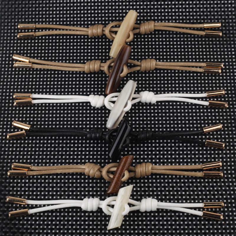 树脂花纹橄榄绳扣 大衣风衣毛呢外套纽扣 牛角羊角对扣 服装辅料