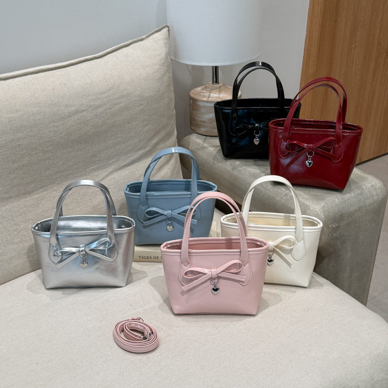 新款蝴蝶结包包女2026新款春季百搭复古斜挎包韩版爆款手提水桶包