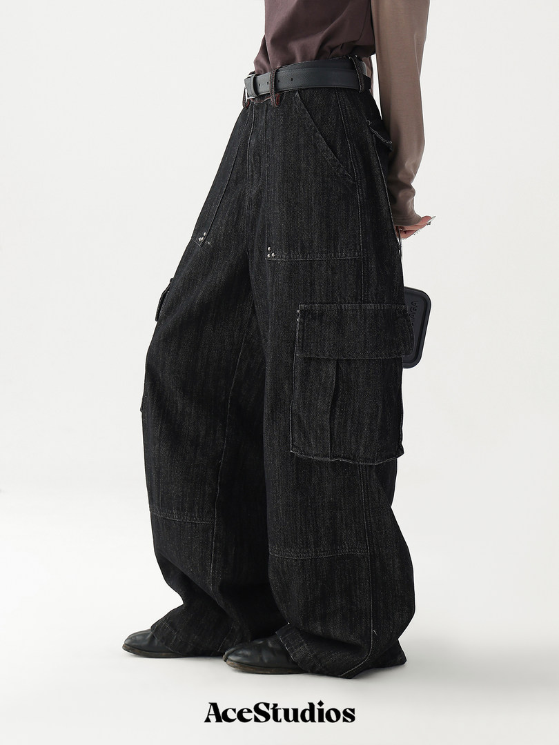 Black oversized denim cargo pants worn by a model