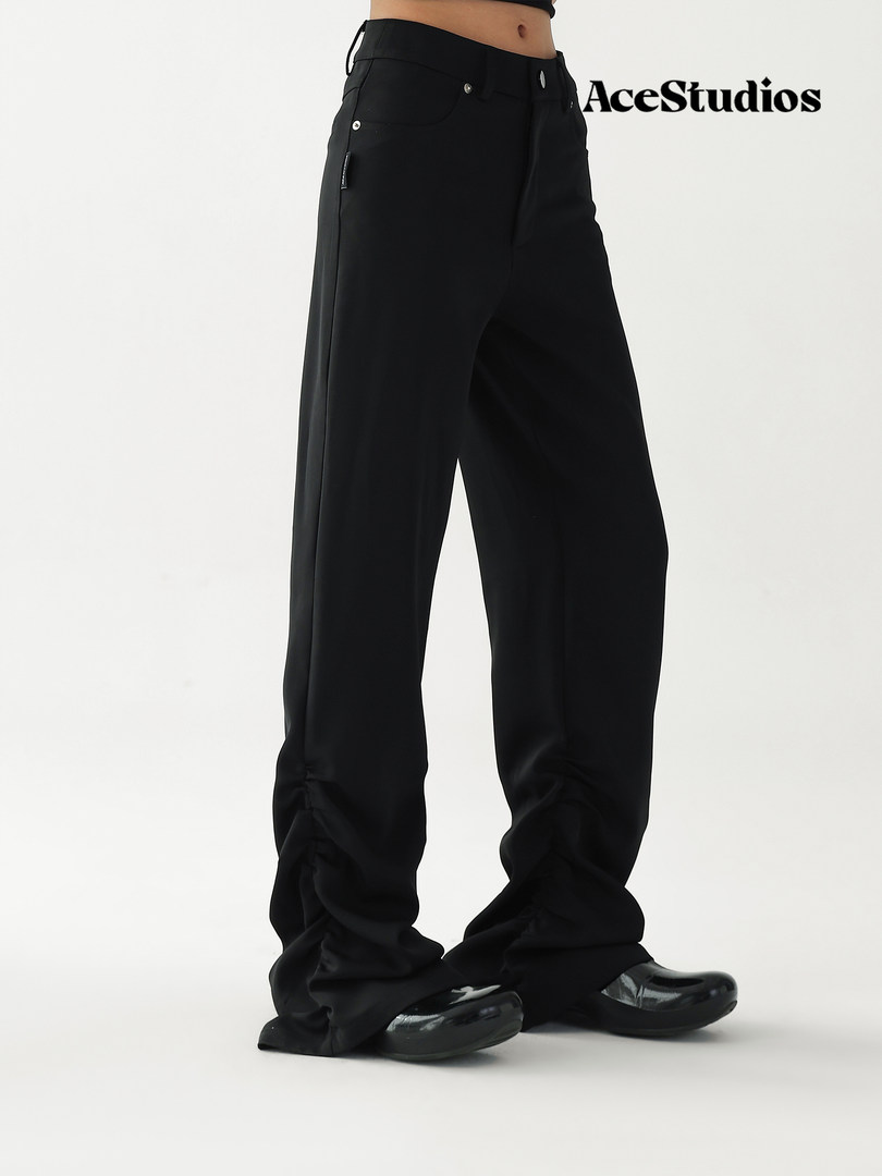Black wide-leg pants worn by a model