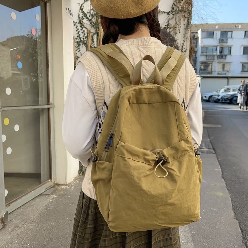 美式日系纯色褶皱尼龙双肩包男大容量轻便休闲旅行背包女大学生电