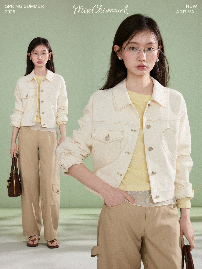 Model wearing a cream jacket and beige pants on a mint background with spring summer new arrival text