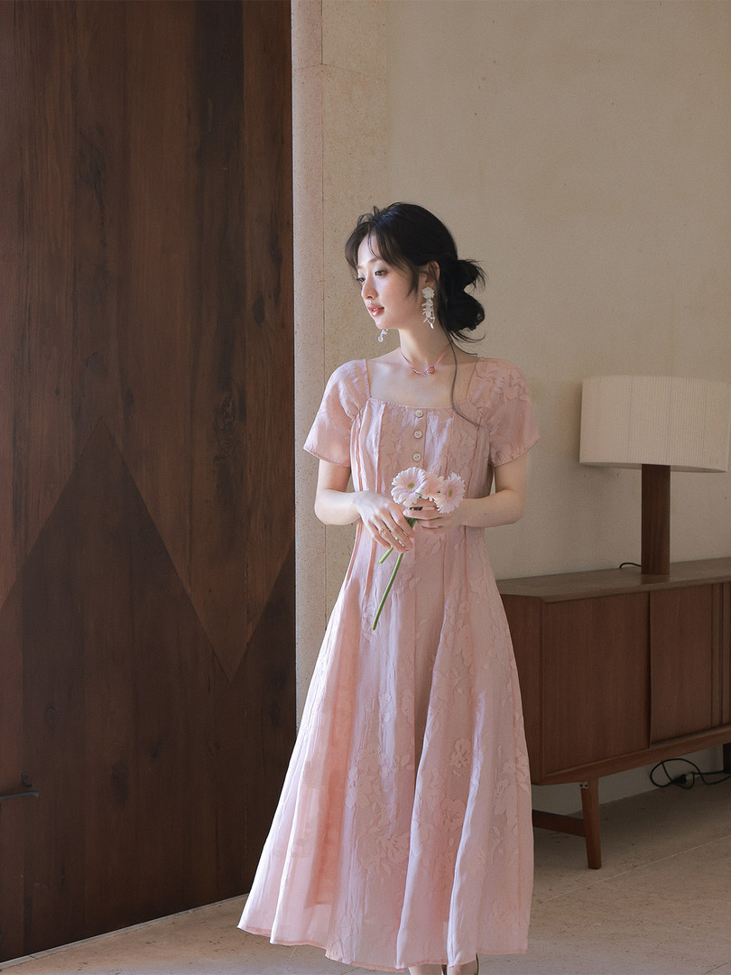 Woman wearing a light pink floral dress