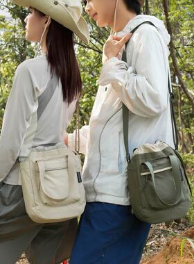 夏天休闲紫色帆布包包女2026新款时尚潮流抽带水桶包斜挎包手机包