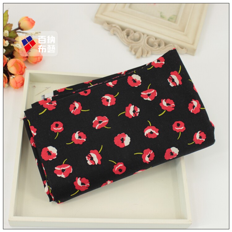 纯棉印花布料桌布床单门帘头巾抱枕服装面料黑底小红花清仓甩卖