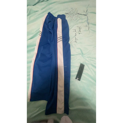 订做都江堰李冰中学宝蓝学生校服裤子侧边红细反光白宽条散口加绒