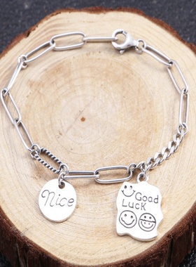 羊羊家s925纯银日韩时尚泰银环圈个性笑脸nics吊牌女士潮流手链