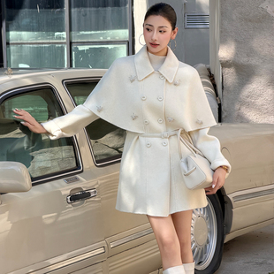 白色毛双面呢大衣女2026秋冬新款双排扣斗篷式腰带气质羊毛呢外套
