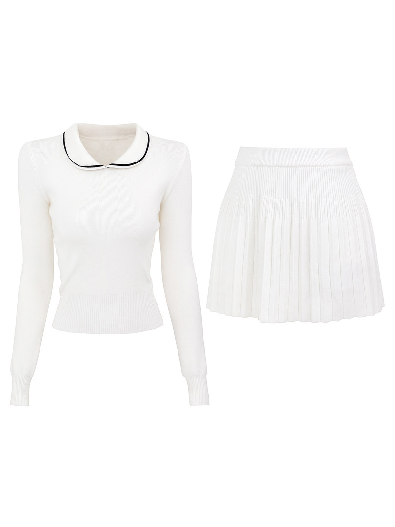 White knit sweater with black trim collar and matching pleated skirt