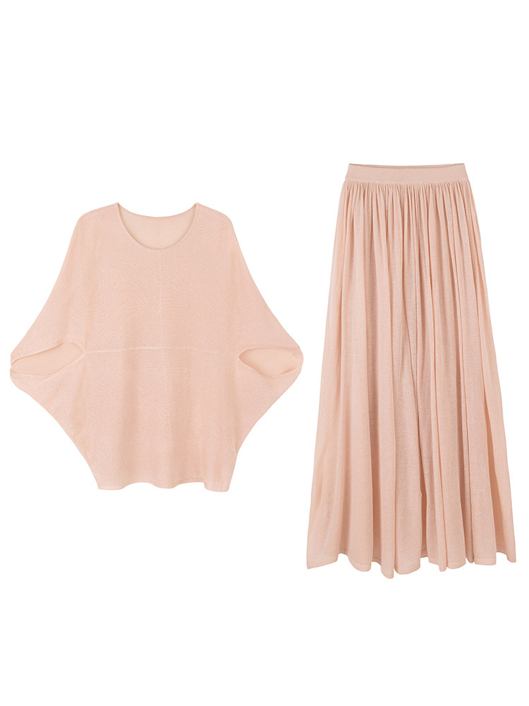 Pink blouse and pleated skirt set displayed flat on white background