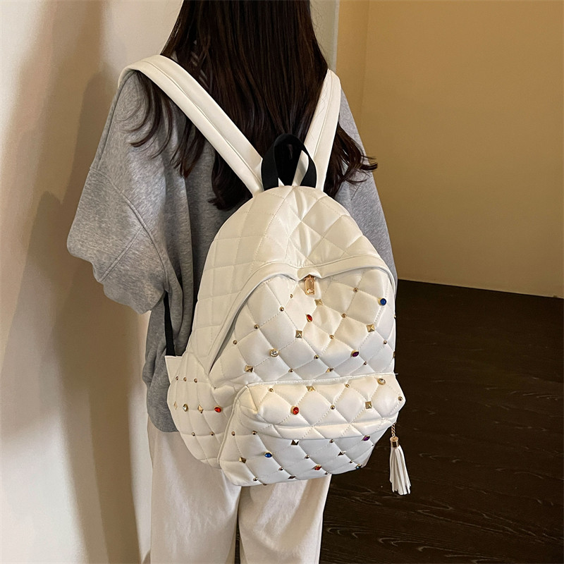 日系潮牌菱格纹彩钻铆钉双肩包女学生百搭流苏实用通勤背包THRASH