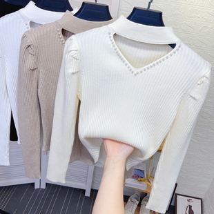 镂空挂脖钉珠半高领打底针织衫女秋冬新款不规则下摆短款毛衣上衣