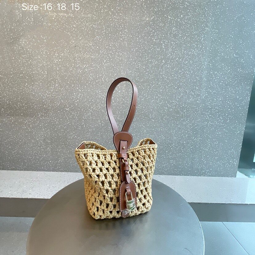 包包女2026新品网红撞色复古牛皮锁扣镂空草编包手提单肩斜挎包潮