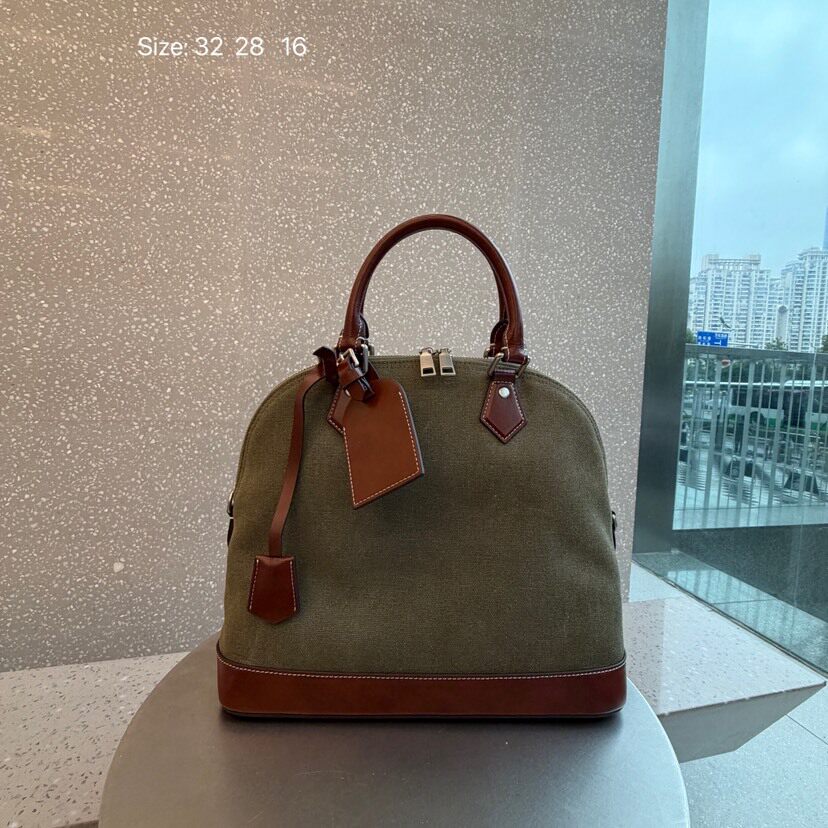 包包女2026新款网红撞色复古牛皮贝壳包帆布拼接手提单肩斜挎包潮