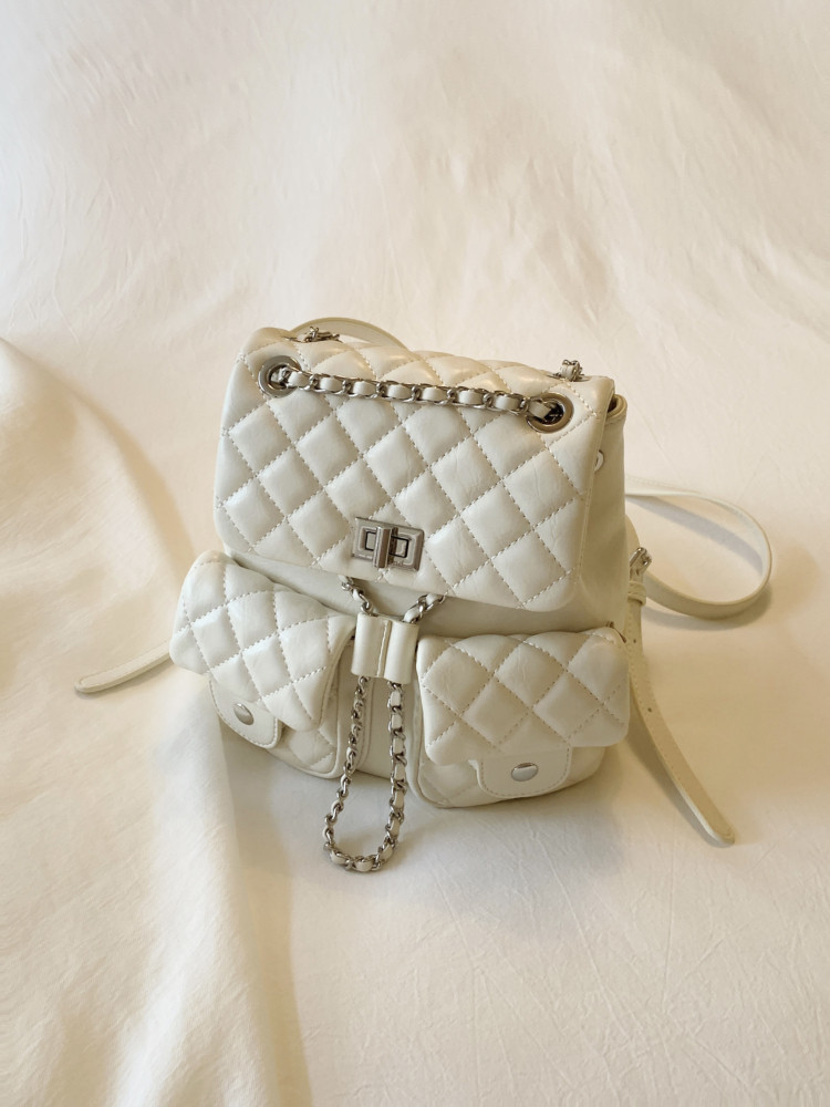 White quilted chain-strap backpack with front pockets