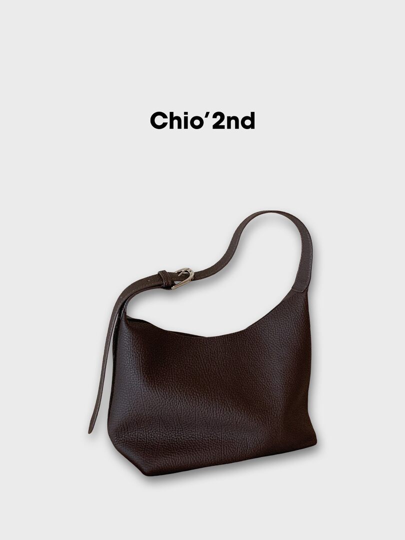 Dark brown leather shoulder bag on a white background with brand text above