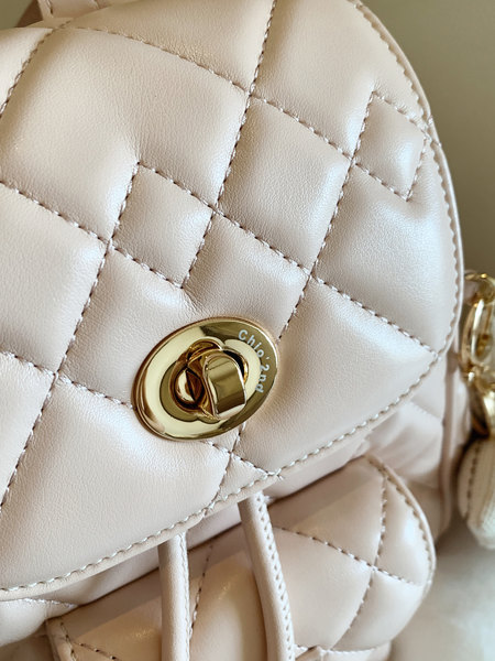 Cream quilted leather handbag with gold hardware