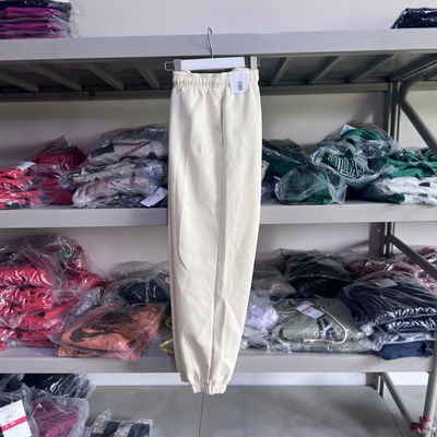 耐克女士纯色休闲束脚运动裤米色