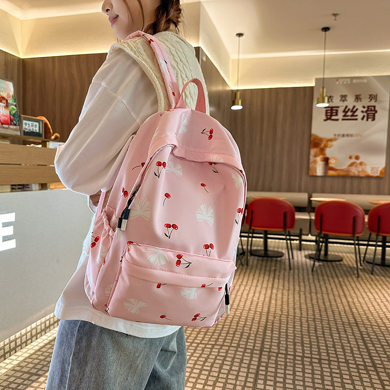 新款韩系小清新书包女大学生简约小碎花双肩包轻便大容量初高中包