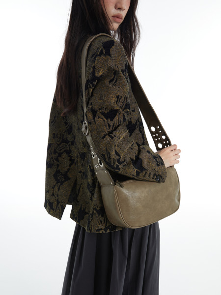Olive green crossbody shoulder bag worn by a model