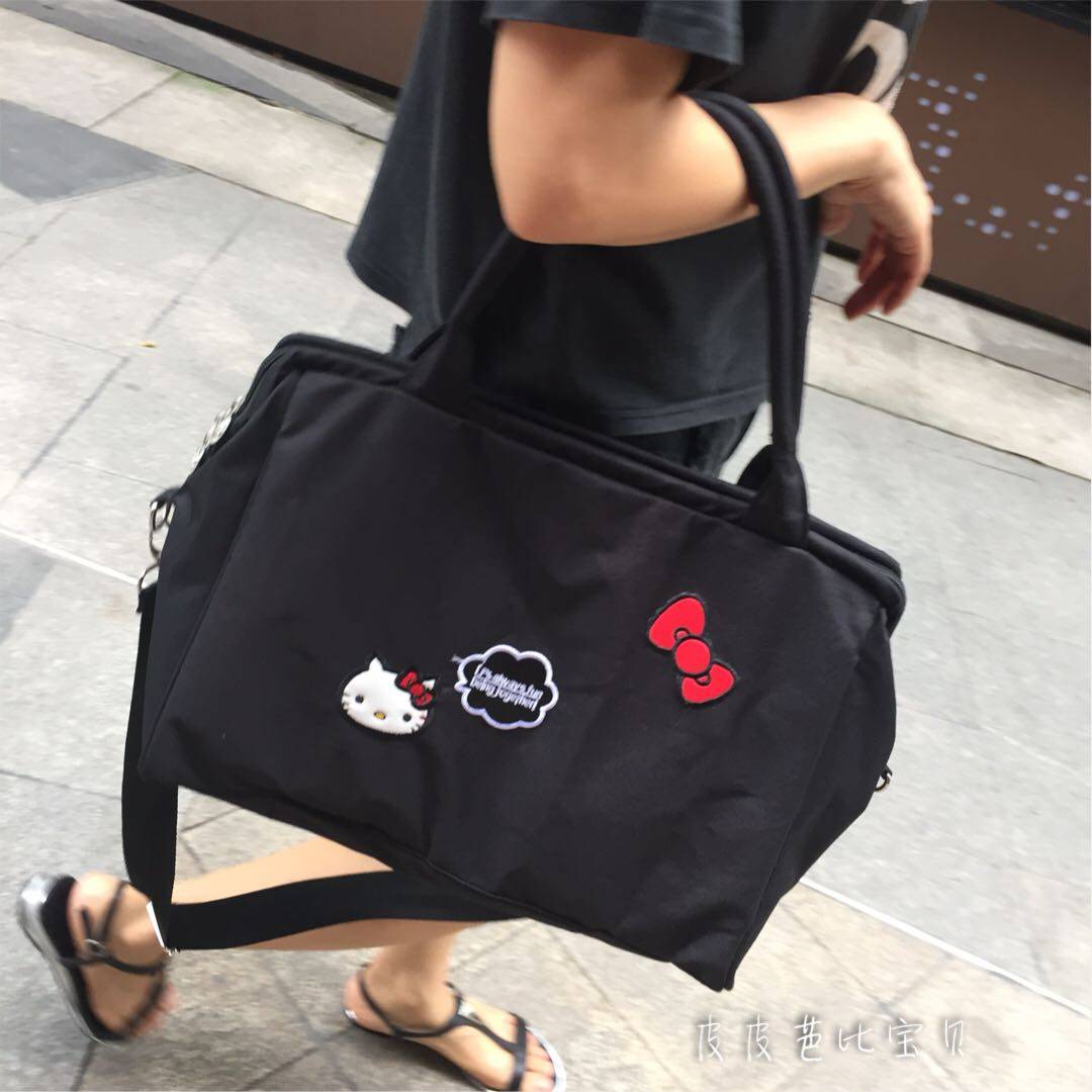 百搭时尚手提斜挎中号推车妈咪包图片