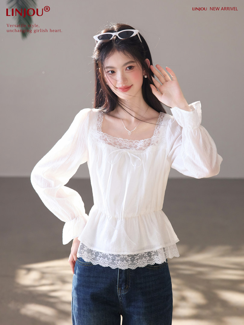 White sheer long-sleeve lace-trim blouse worn by a model