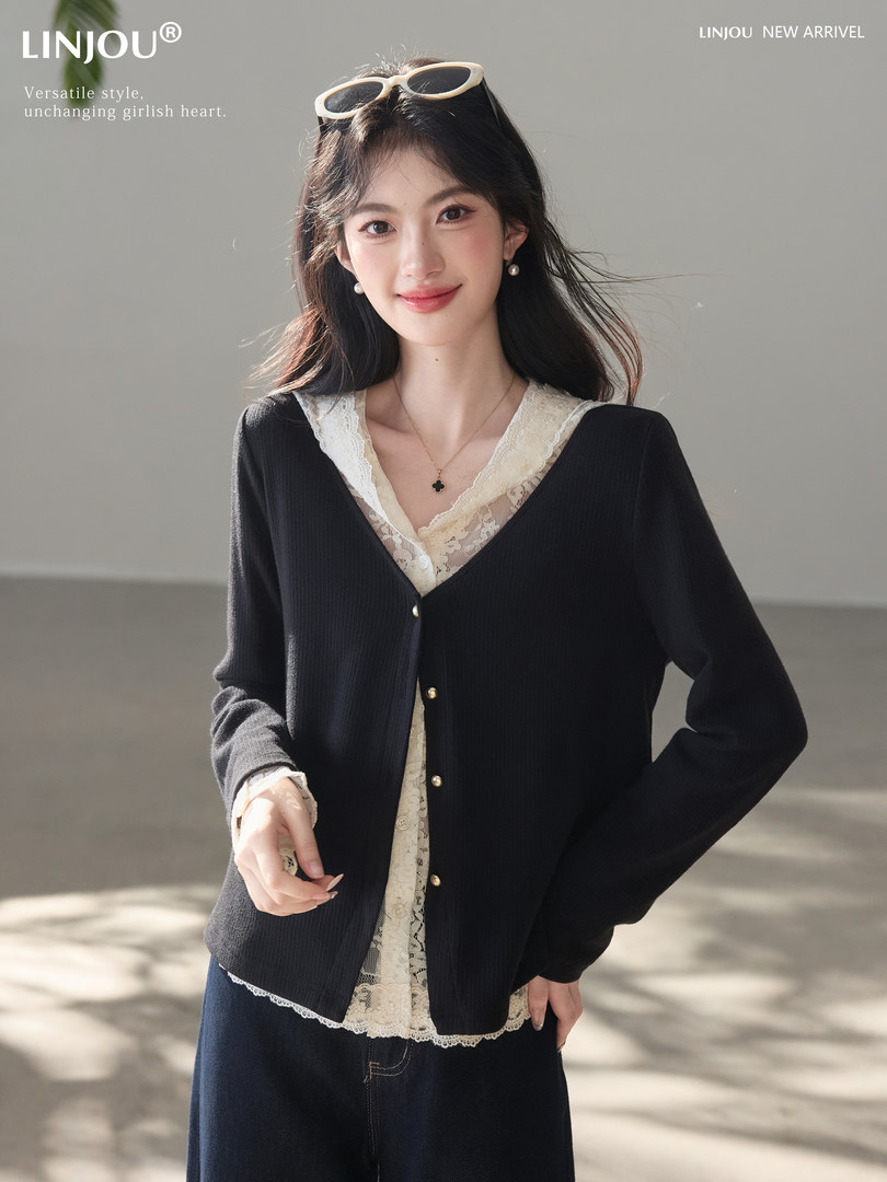 Model wearing a black cardigan over a lace-trim top