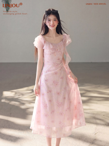 Pink floral off-shoulder dress worn by a model