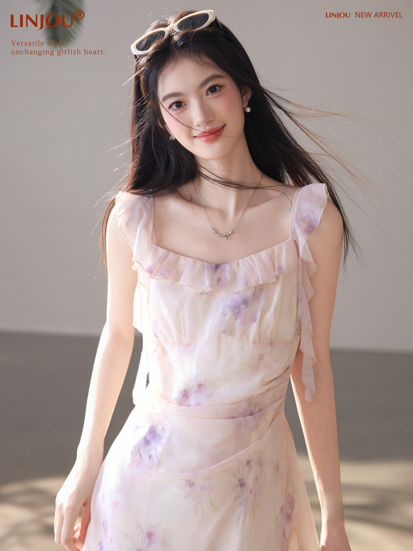 Model wearing a pastel floral ruffled dress