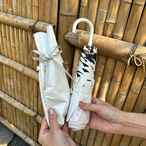 日本wpc防晒伞小巧便携遮阳韩式蝴蝶结太阳伞防紫外线黑胶晴雨伞