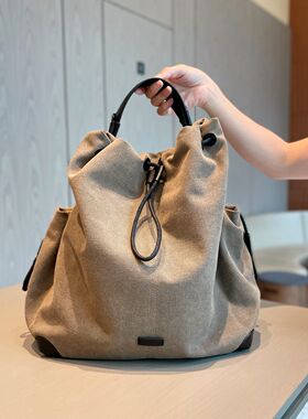 轻奢帆布高颜值双肩包女2026新款轻便通勤女士背包高级小众旅游大