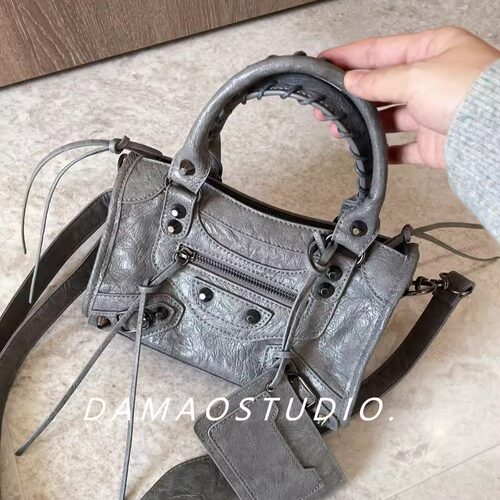 铆钉流苏机车皮包单肩斜挎迷你女
