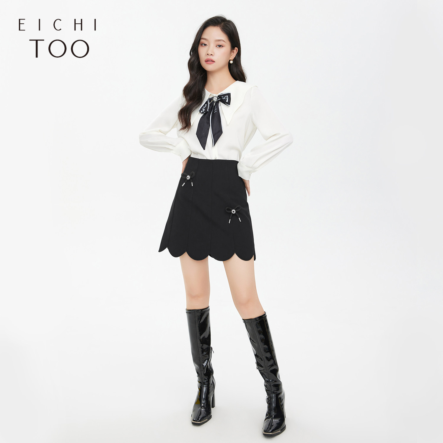 爱居兔秋季新女装半身裙蝴蝶结配饰绣花边裙摆时尚短裙a字裙