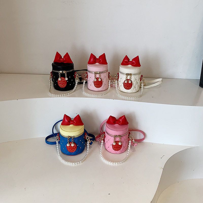 韩版儿童水桶包新款可爱蝴蝶结手提包洋气女童珍珠链条单肩斜挎包