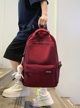 大容量减负纯色双肩包男高中大学生书包女简约黑色旅行背包初中生