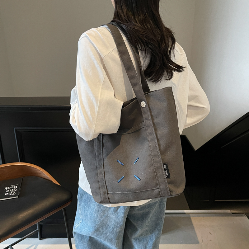 红鹮鸟日系休闲大学生上课单肩帆布包包女2025出行通勤大容量