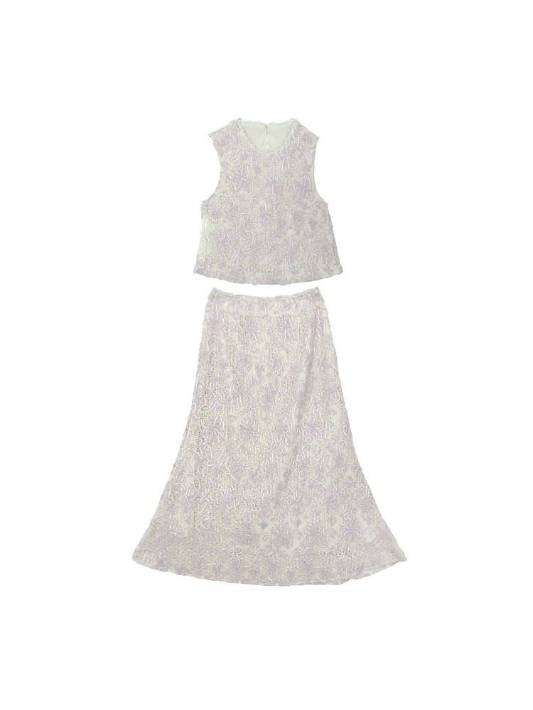 Light-colored sleeveless top and matching skirt laid flat on a white background