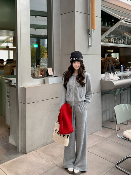 Gray zip-up hoodie and wide-leg sweatpants worn as a casual set