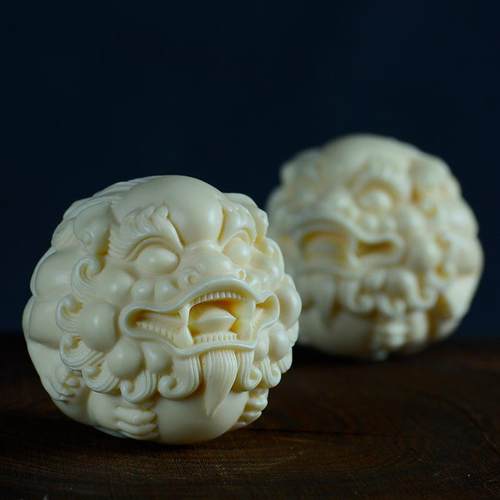 象牙果貔貅狮子头手球手把件