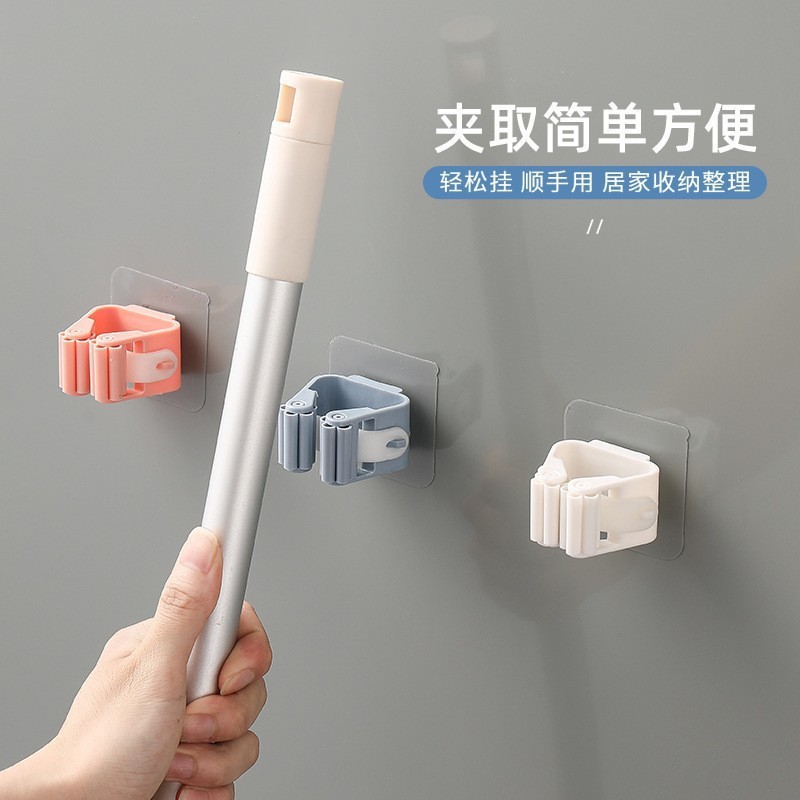 拖把夹免打孔强力粘贴挂钩无痕壁挂式粘钩贴扫把架可伸缩拖布夹图片