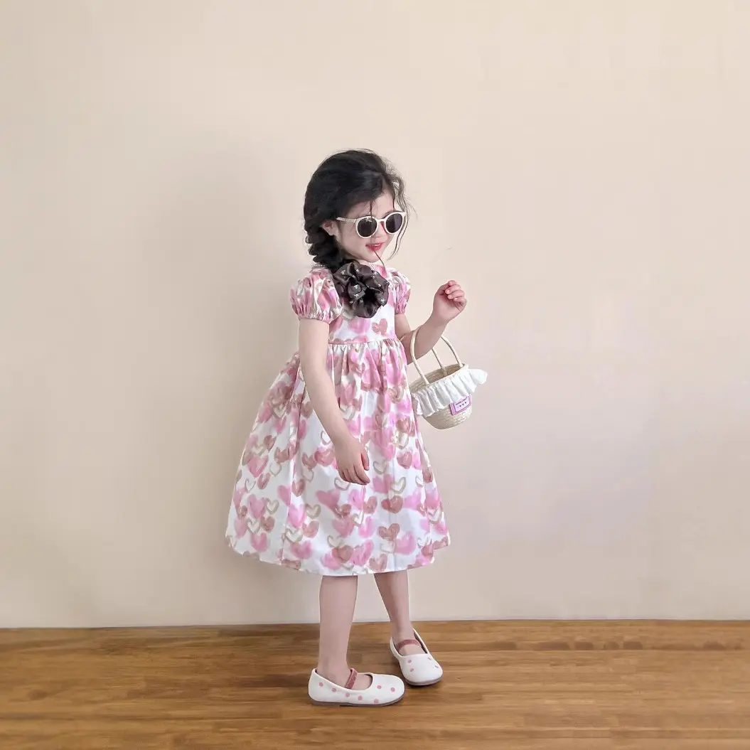 2025女童夏季韩版童装交叉露背公主裙满印粉系爱心泡泡短袖连衣裙