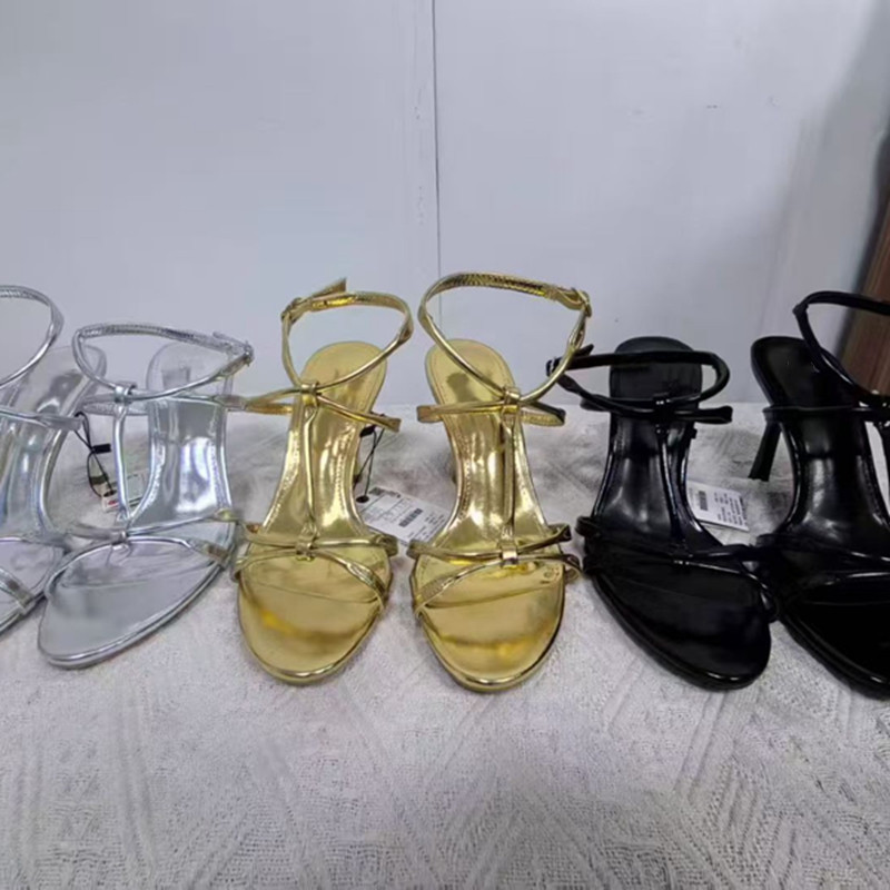 西班牙2026春季新款一字带金色中空高跟女鞋绑带细跟名媛露趾凉鞋