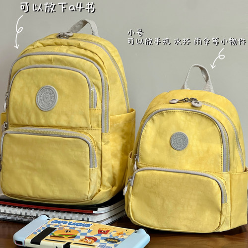 介奶黄色小背包上身真的元气满满
