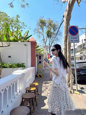 oker章壳儿波点不规则半身裙女2026春装新款荷叶边A字天丝半裙755