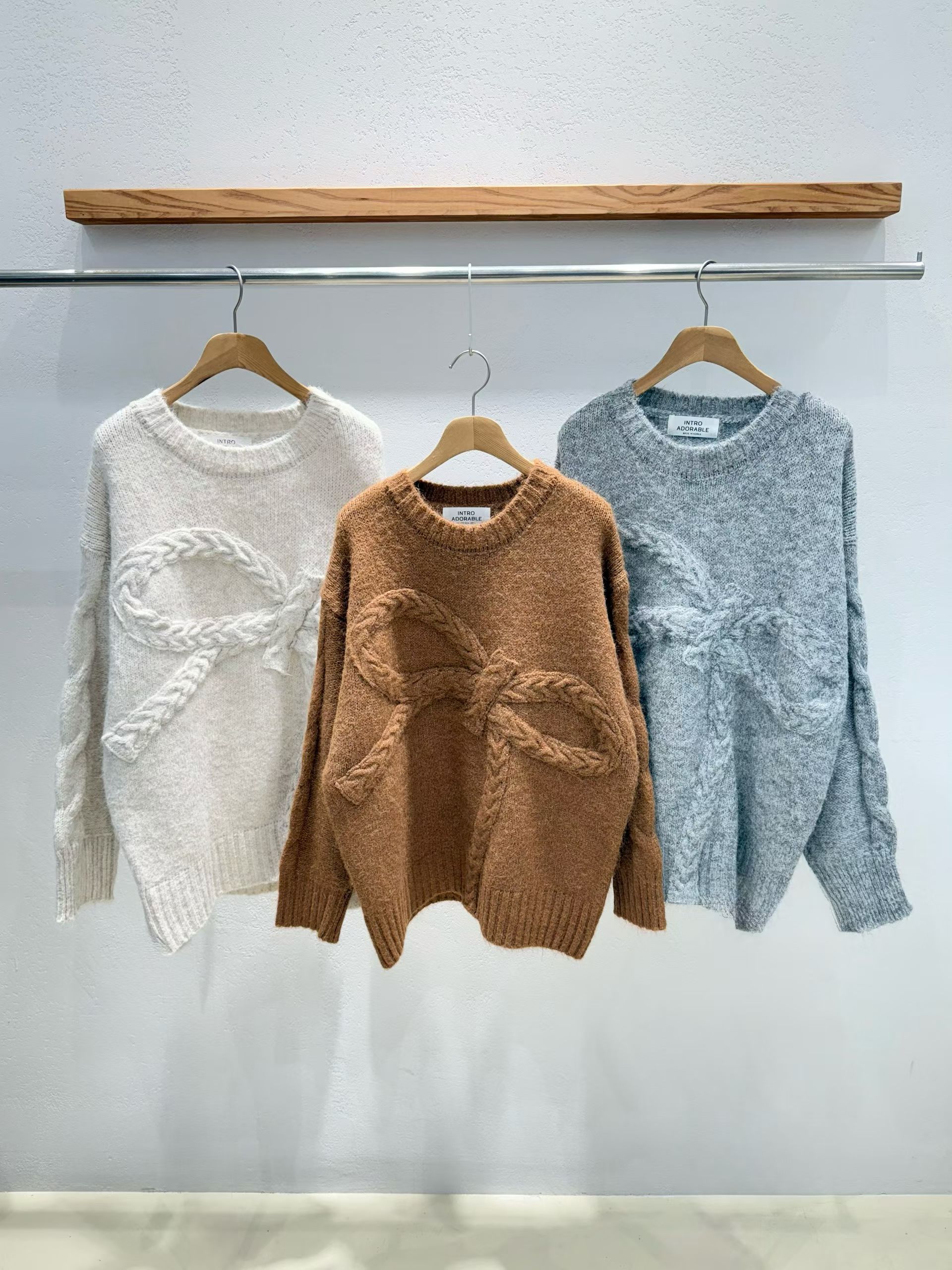 韩国东大门2025冬新款INTRO蝴蝶结宽松毛衣