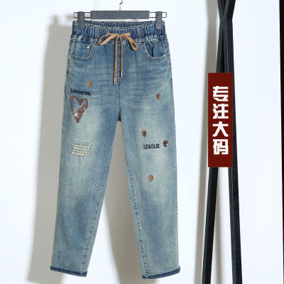 胖人大码哈伦松紧腰刺绣牛仔裤女