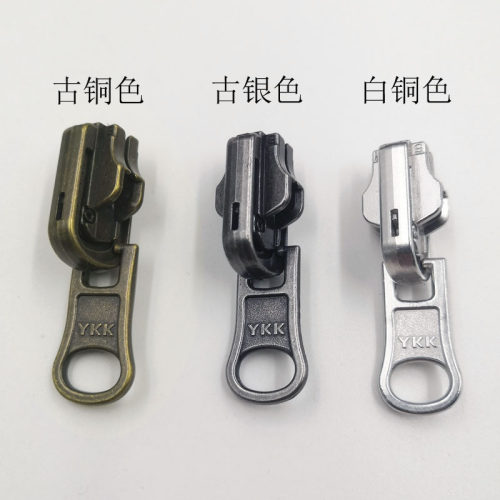YKK5号古银色金属树脂双面旋转拉头DU拉链头服装辅料带锁