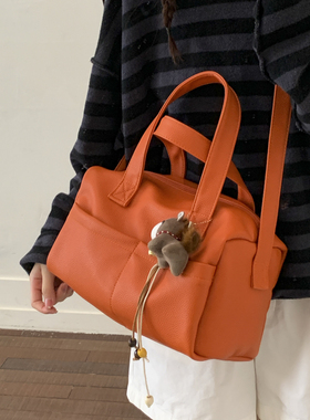 韩版多巴胺休闲风手提包女2026新款橙色单肩包百搭通勤斜挎枕头包