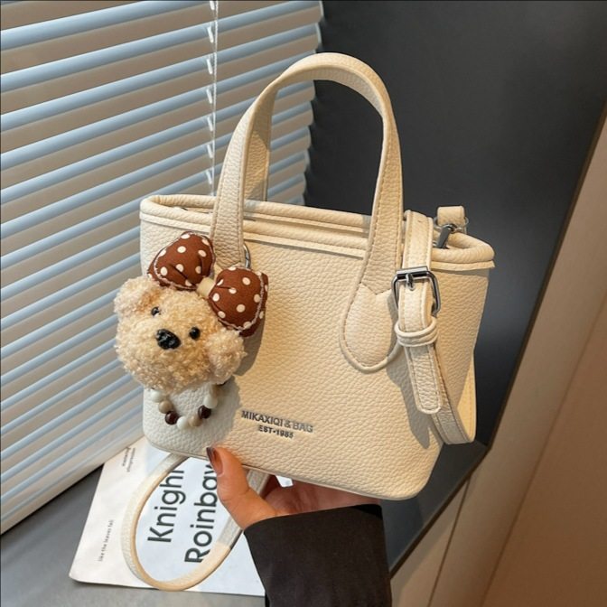 简约时尚水桶包包女式2026春新款百搭休闲手提包高质感单肩斜挎包,箱包皮具/热销女包/男包,水桶包,淘宝优惠券,粉丝福利购,淘宝优惠卷