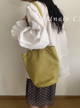 韩版高级感棉麻红色水桶包女小众复古单肩斜挎包大容量通勤购物袋